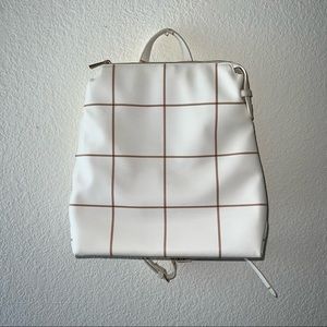 White and brown backpack purse